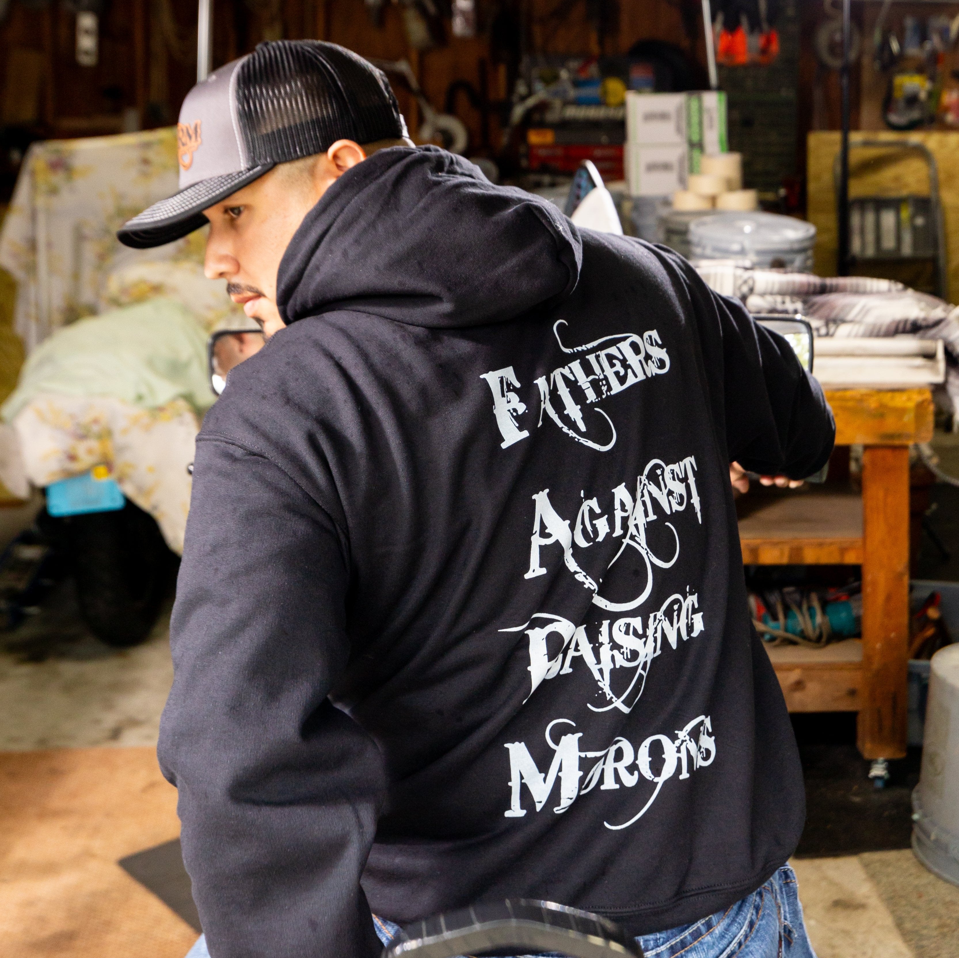 FARM hoodie back josh getting ready to take the bike for a ride