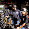 FARM black hoodie and black charcoal black hat with josh teaching ryder about bike
